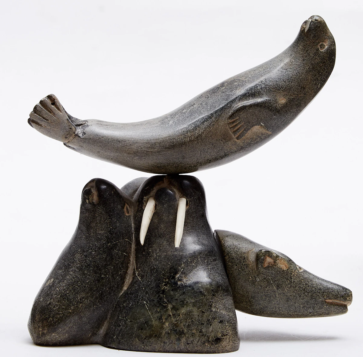 Mususi Uniurtitak Ainalik, Composition with Walrus, Seals, Bear and Face, segmented stone; ivory; wood