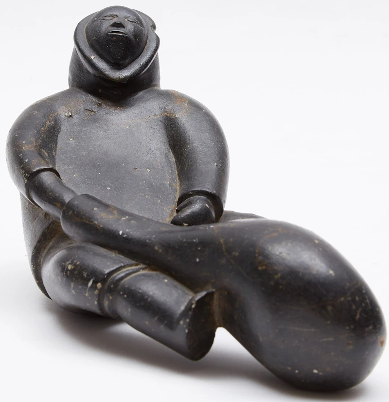 Sitting Figure with a Seal Float by Noah Qinuajua