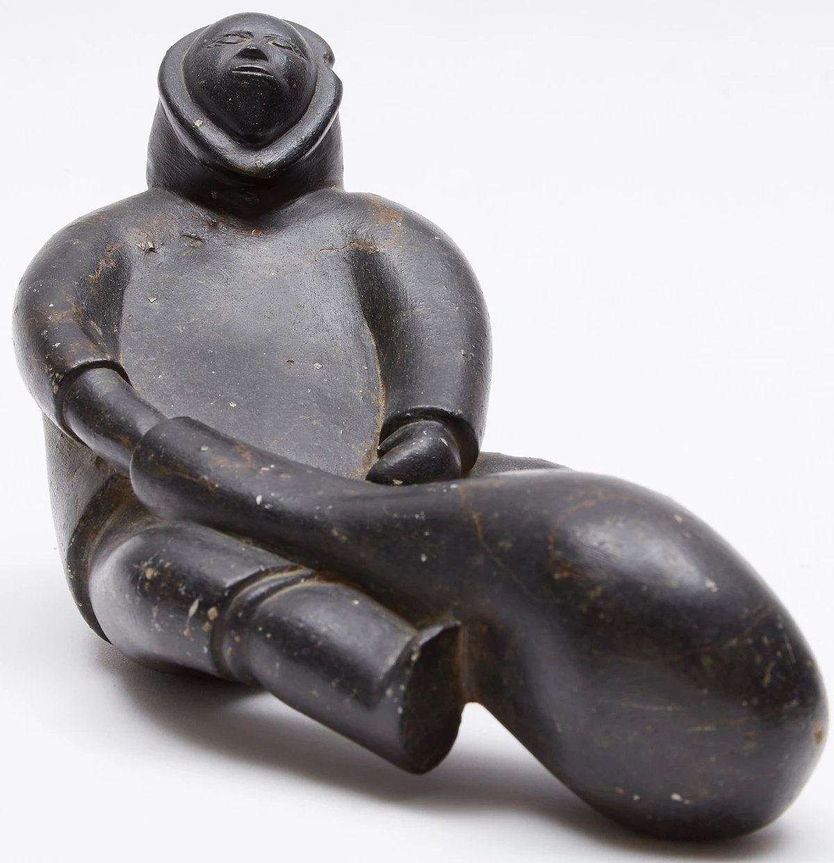 Noah Qinuajua, Sitting Figure with a Seal Float, stone