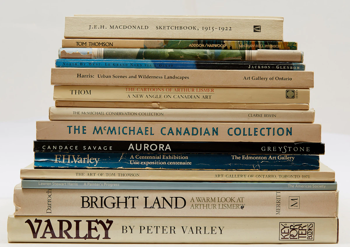 Books and Reference, Fifteen Reference Books related to Tom Thomson and The Group of Seven (with transparency of the “Northern Lights” by Tom Thomson), fifteen books and one transparency