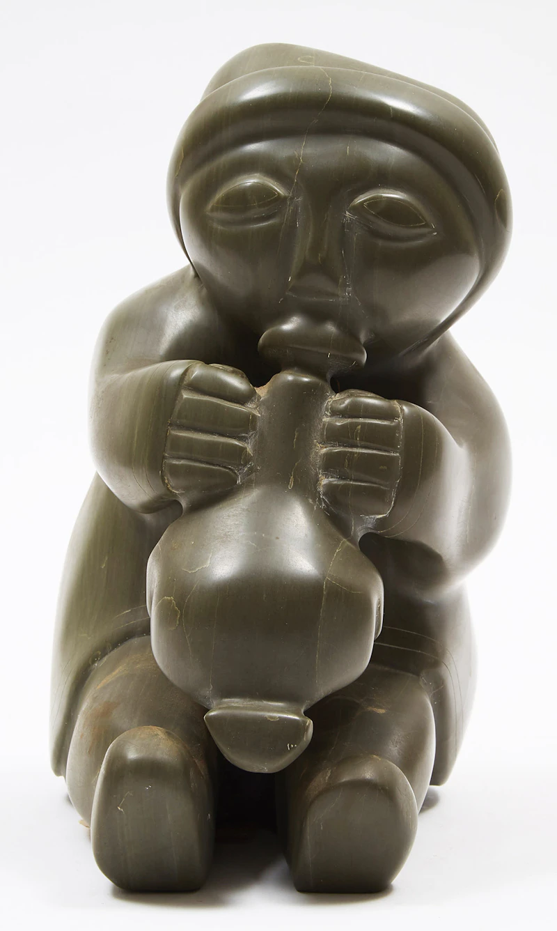 Woman Blowing up a Sealskin Float by Unidentified Inuit Artist (Sanikiluaq)