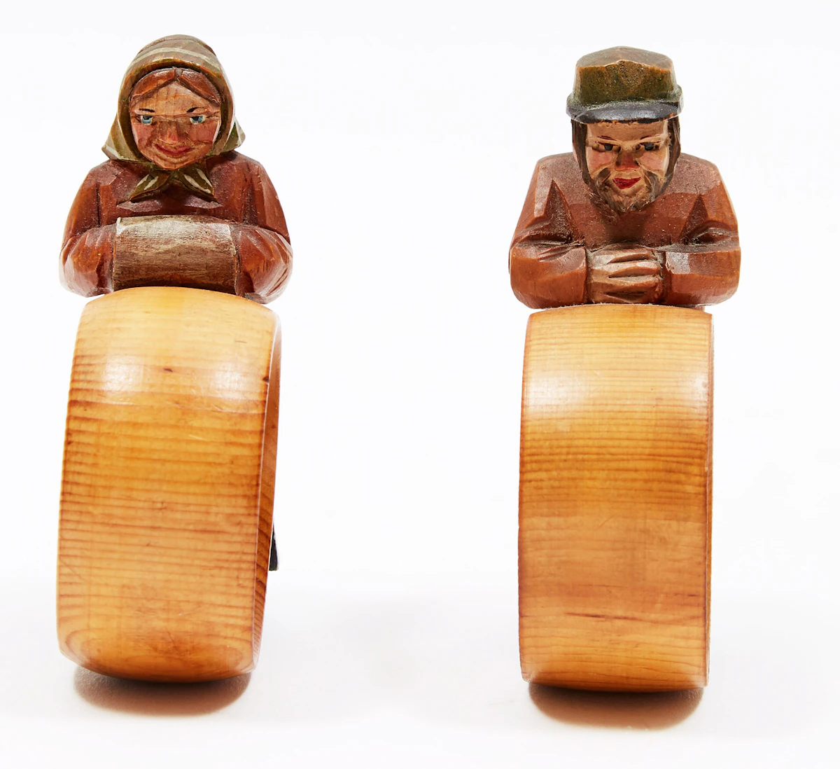 Attribued to Paul Caron, Two Napkin Rings: Man and Woman, two carved & painted wooden napkin rings