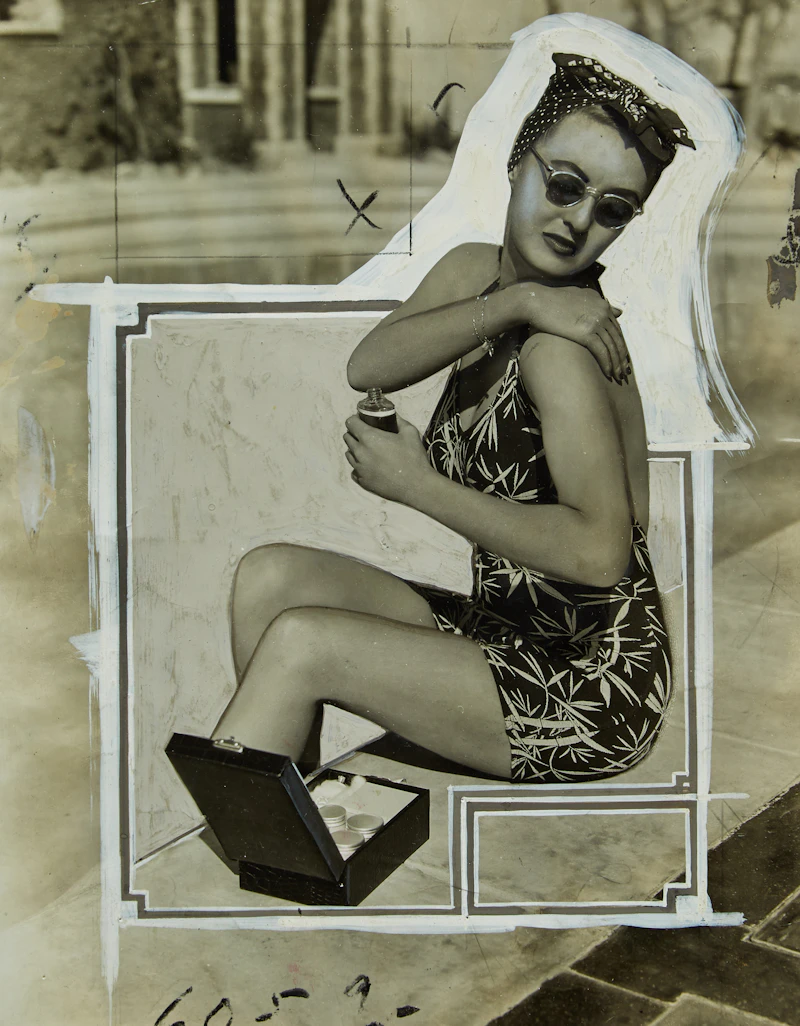 Bette Davis Applying Sunscreen by Unknown Photographer