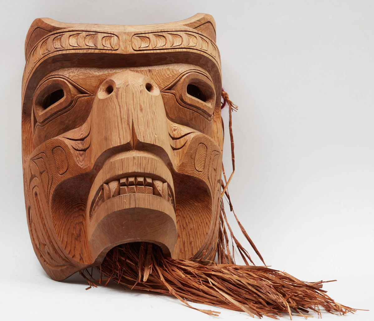Stan Hunt, Kwa- Guilth Sea Bear , unpainted wood with cedar bark