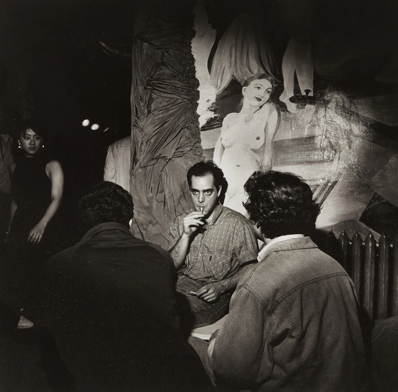 Man with Reefer, Nude on Wall, NYC by Larry Fink